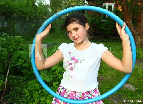 Girl swinging hula hoop