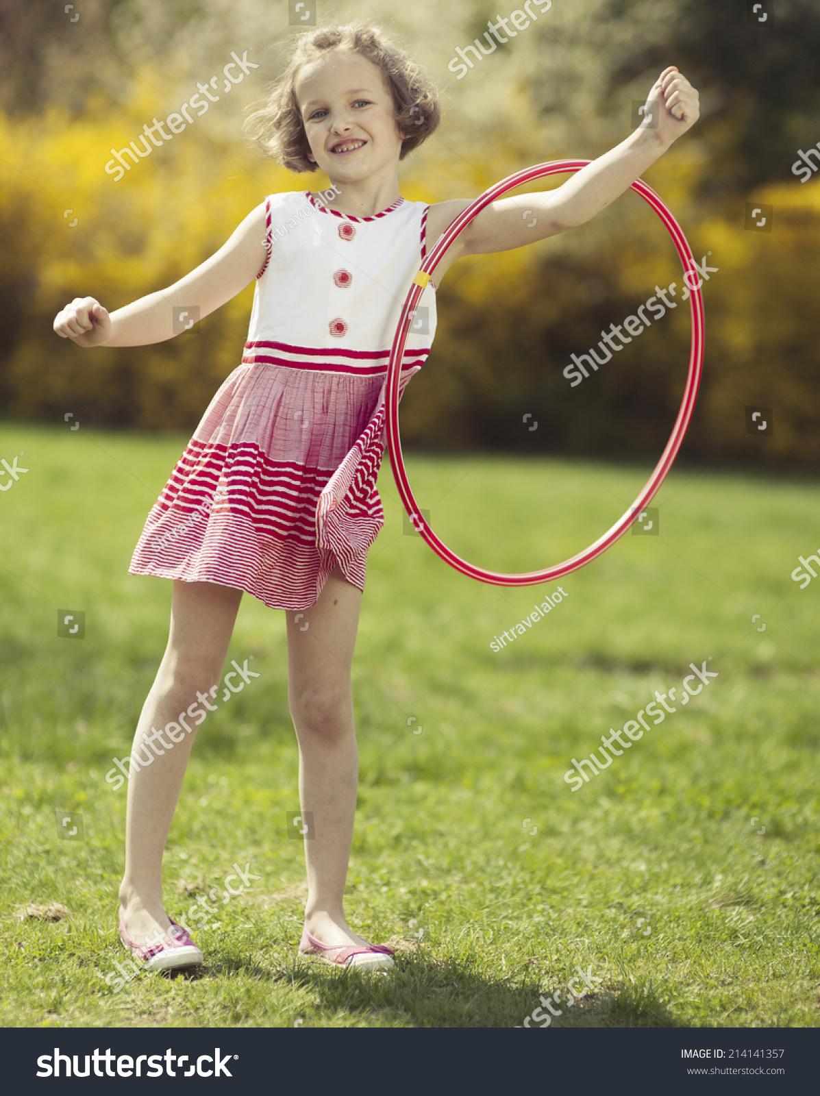 Girl swinging hula hoop